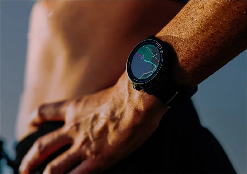 Smartwatch on a person's wrist with a map displayed on the screen against a blurred background